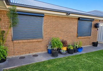Modern home with Roller shutters Gawler on brick exterior windows