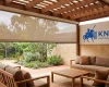 Track-guided outdoor blind fitted to an Adelaide alfresco