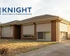 Motorised roller shutters closed against summer sun on an Adelaide home
