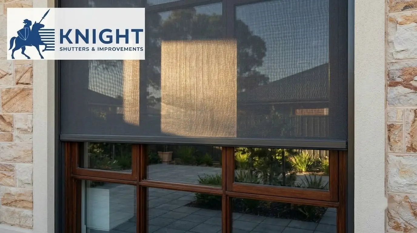 Mesh external blind fitted over a west-facing window on an Adelaide home