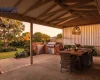 Outdoor blinds lowered on one side of a covered patio in Adelaide