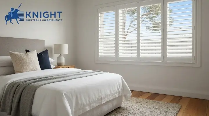 White plantation shutters with louvres partly open in an Adelaide bedroom