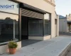 Commercial roller shutter half raised on an Adelaide shopfront