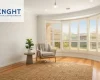 White plantation shutters on a bay window in a bright Adelaide living room