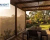 Pergola in Adelaide with outside shade blinds lowered on the sunny side