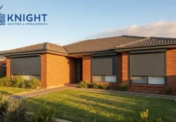 Charcoal roller shutters fitted to the windows of a brick home in Adelaide