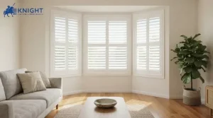 White plantation shutters fitted across a bay window in an Adelaide lounge room
