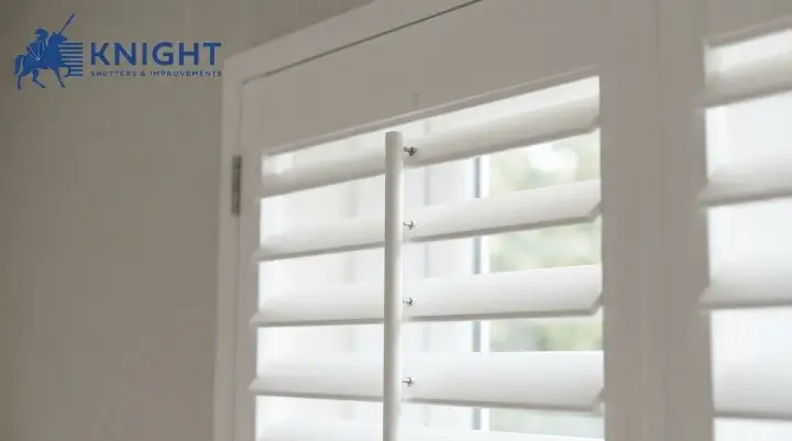 Close-up of plantation shutter louvres and tilt rod showing the finish